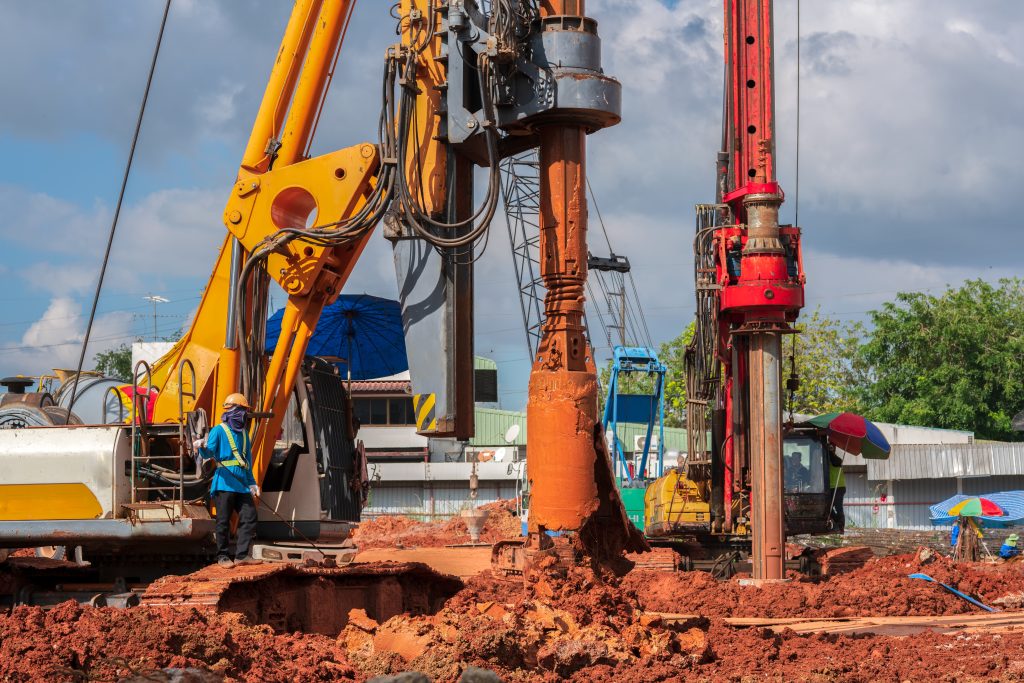 Industrial drilling rig machinery on building construction site.Drilling vehicle construction concrete piles on working