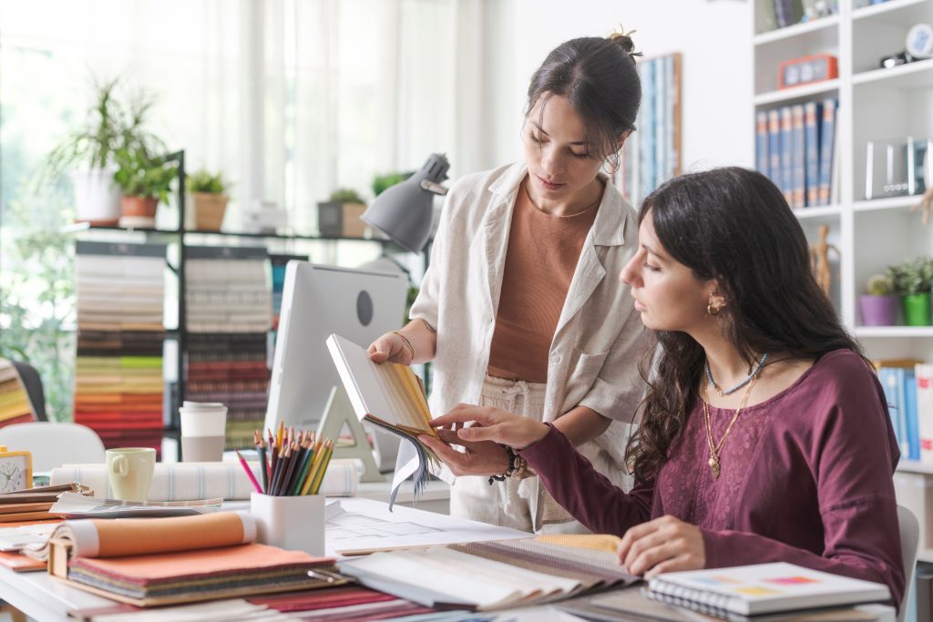 Professional interior designers checking fabric swatches